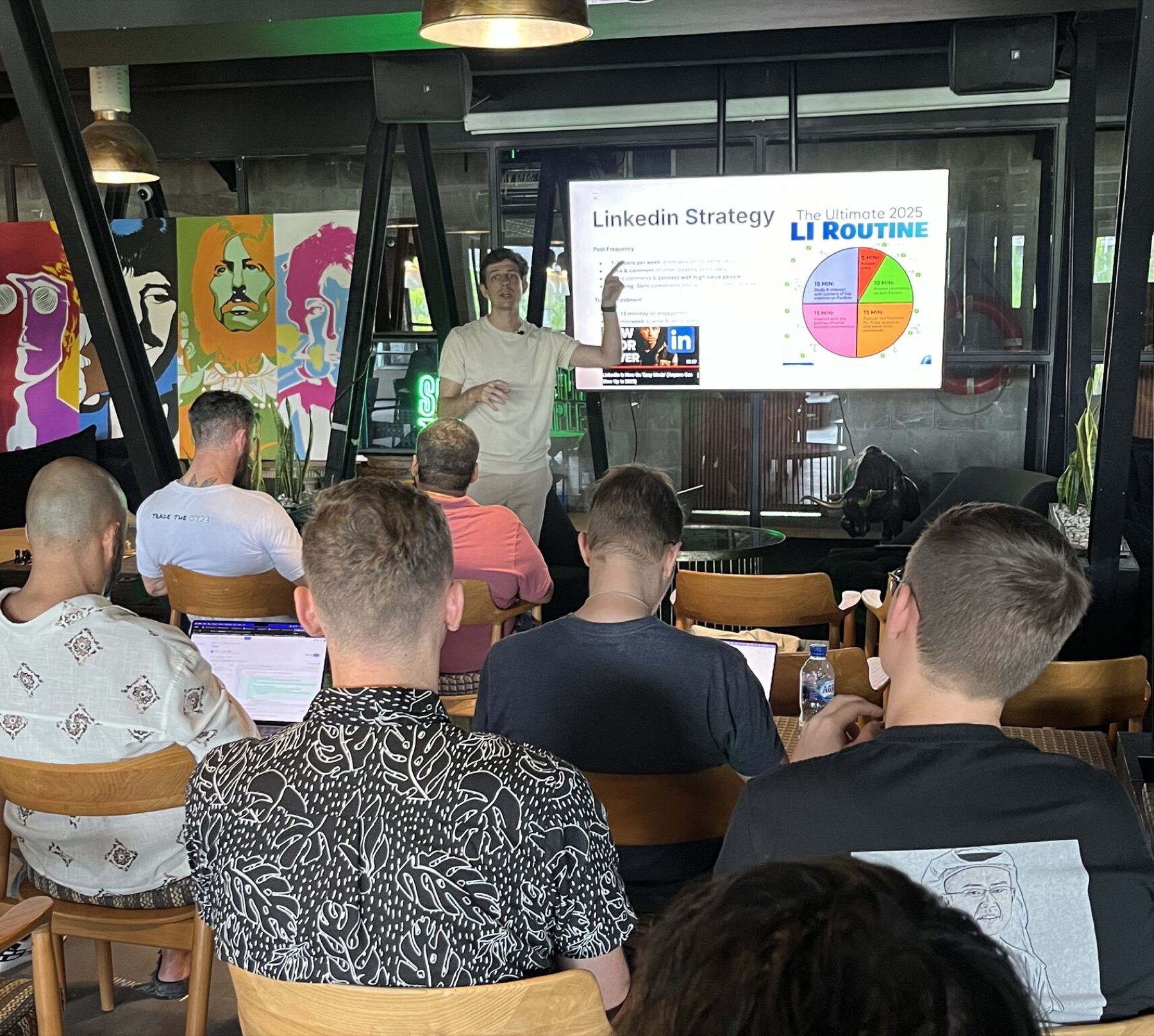 Cosmo giving a workshop to a seated audience